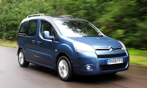 Blue Citroen Berlingo Car in the Road